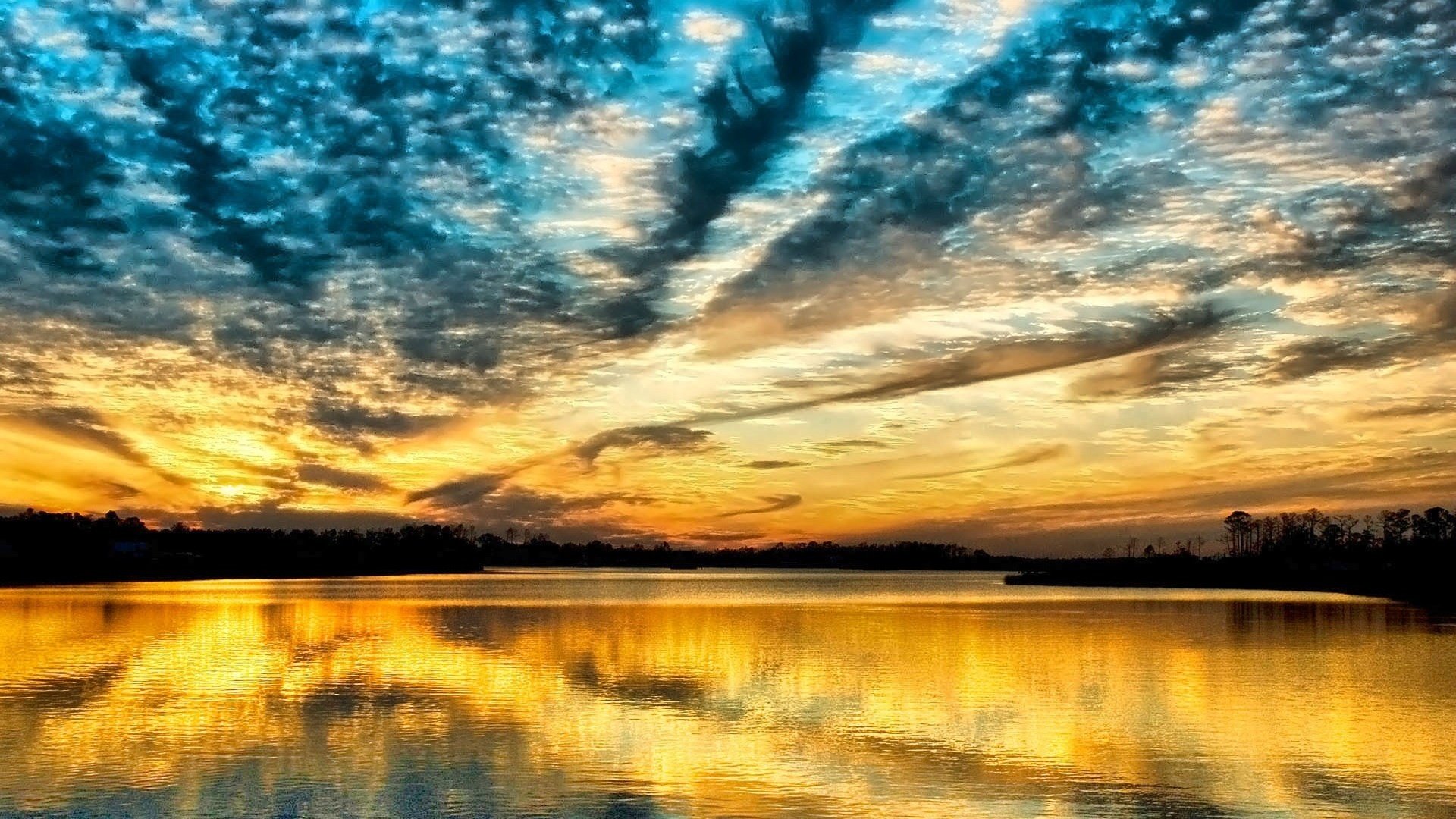 rayos amarillos cielo granulado puesta de sol cielo agua lago nubes naturaleza paisaje noche