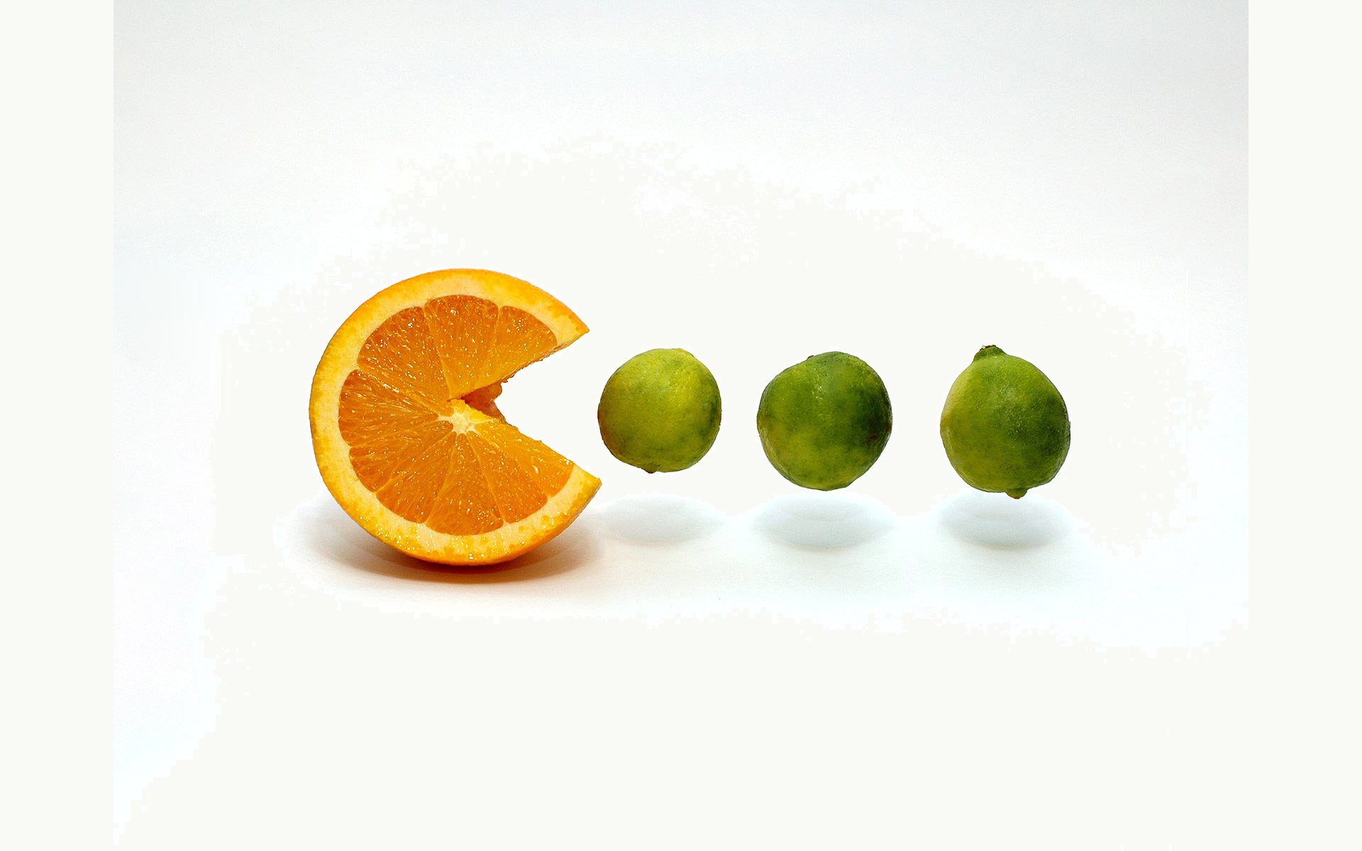 orange slice fruit orange lime fruit pakman joke idea white background light background creative game fruit