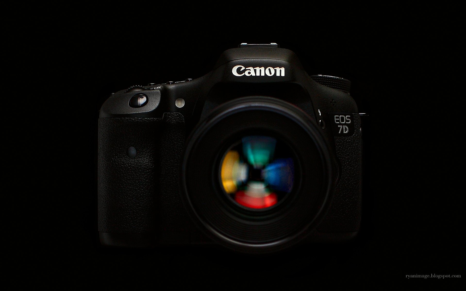 a camera canon eos 7d ef 100mm f2.8l macro hybrid is black background