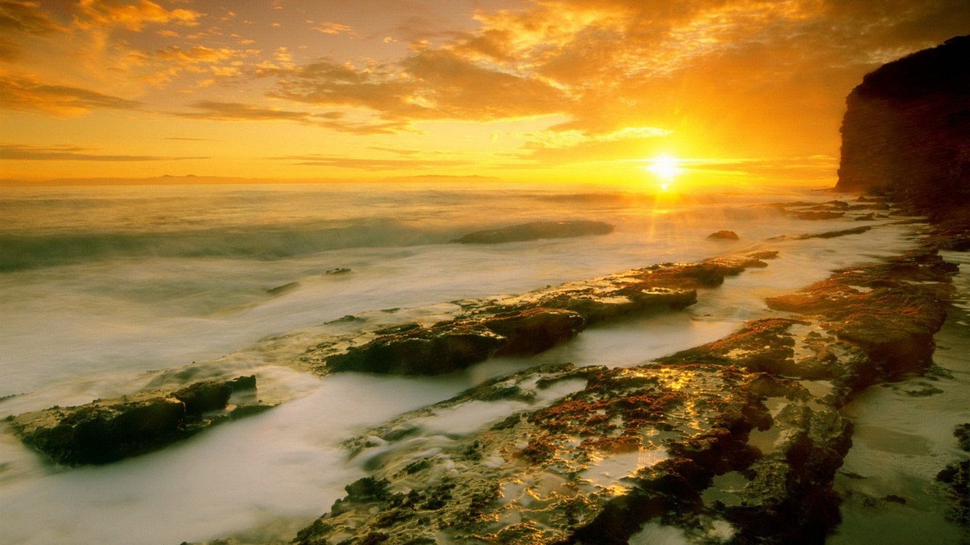 golden sky stone hills foam wave sunset stones the sun horizon clouds landscape nature sea surf