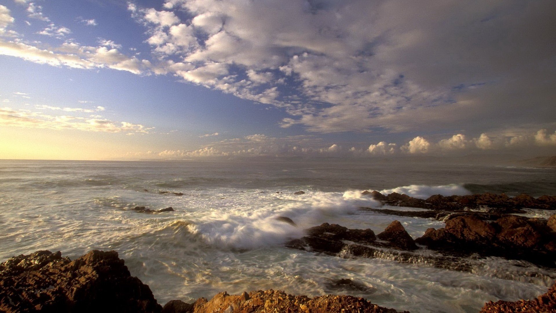 waves with foam rocky shore storm winter sky sea storm waves evening sunset clouds shore rocks stones nature landscape horizon