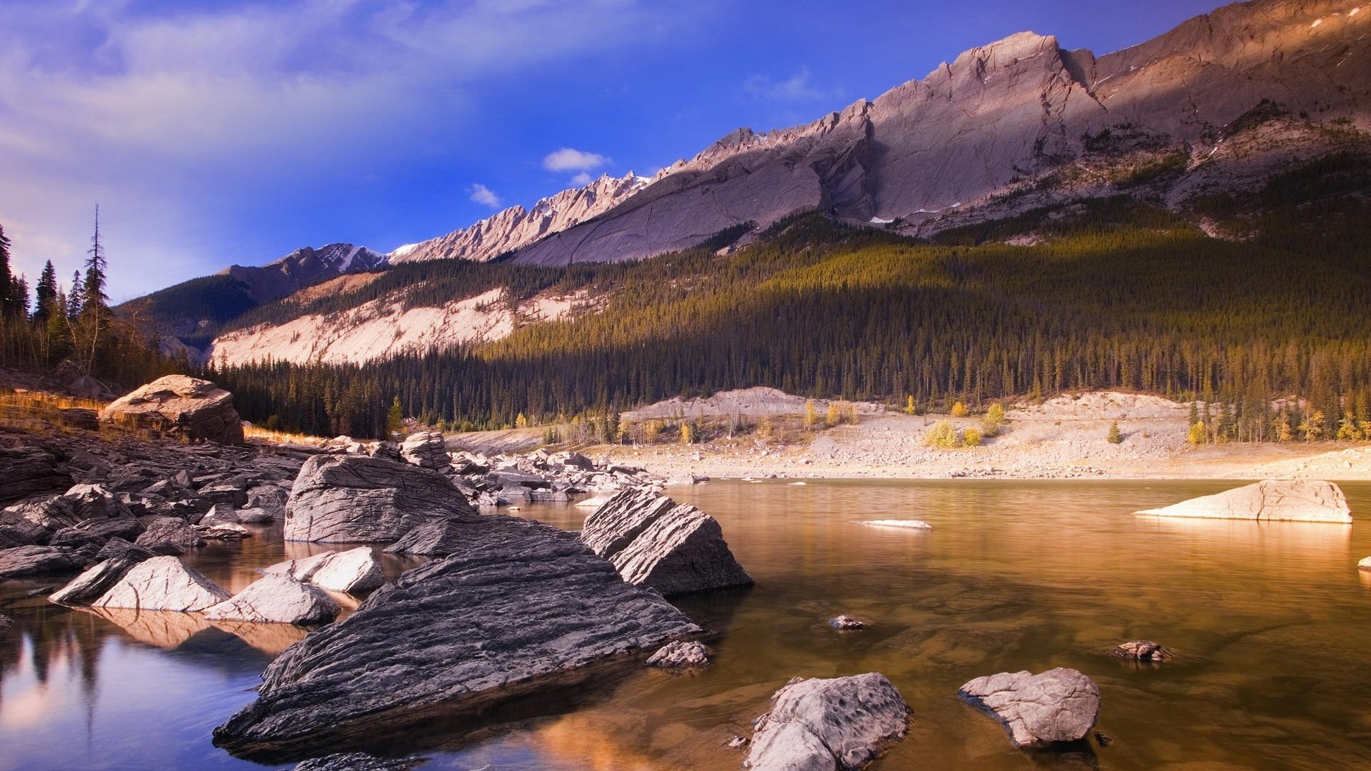 water in the mountains cobblestones shadow mountains forest fir trees needles current lake river nature landscape stones sky cloud