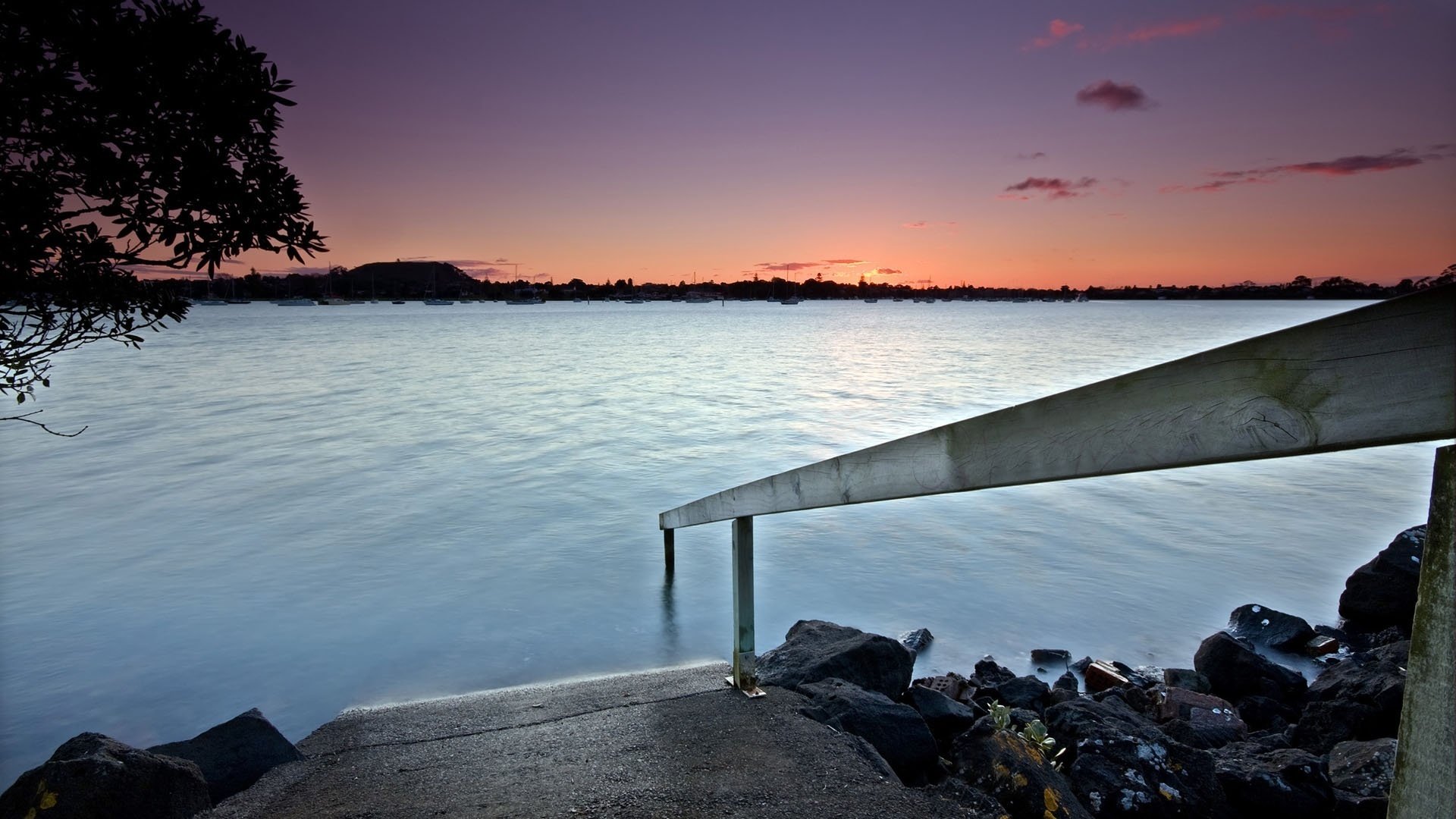 the descent into the water crystal lake rocky shore sunset water the sky the descent railings lake stones landscape view nature the evening