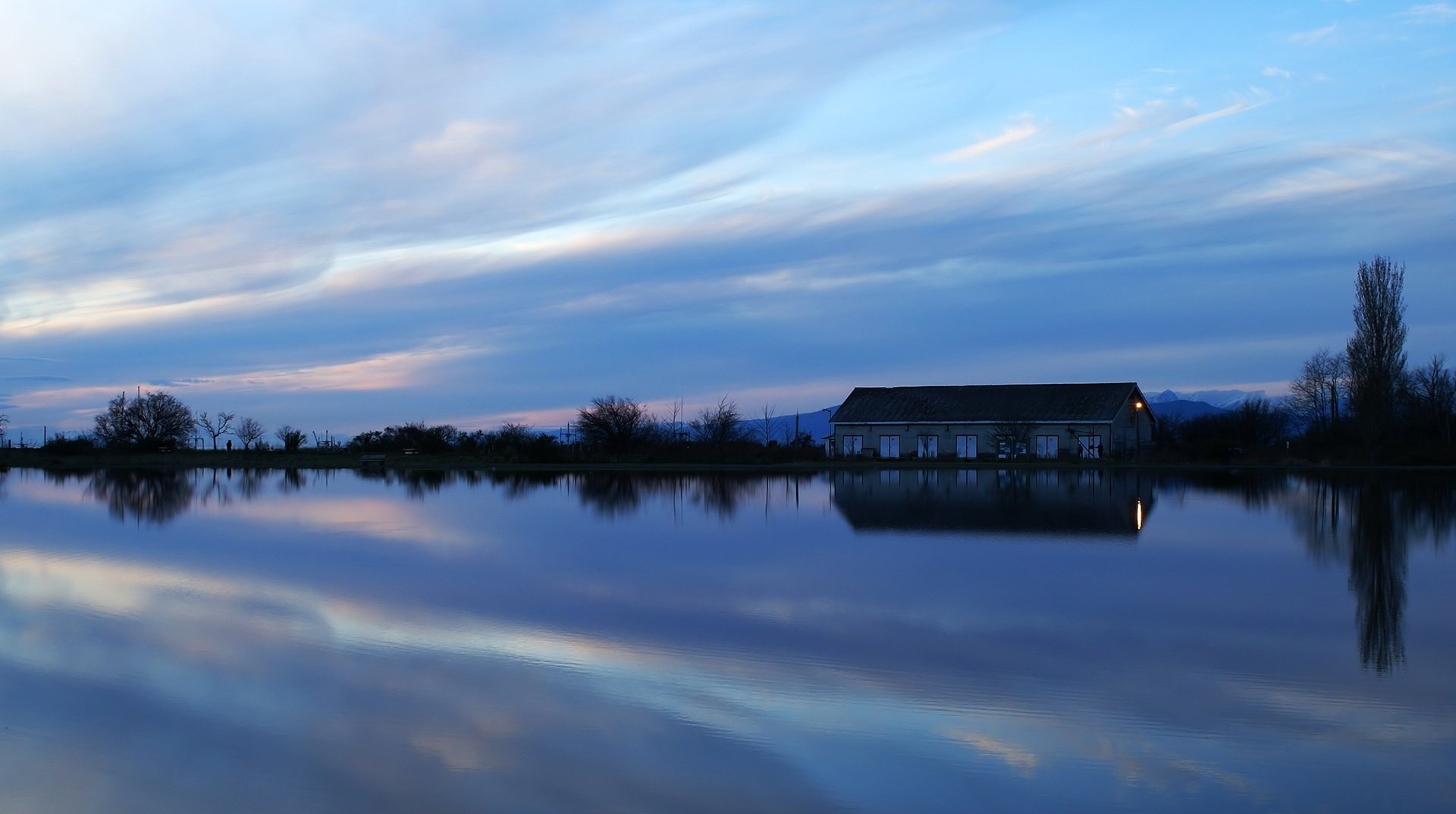 the lake house the reflection in the water twilight the sky water home