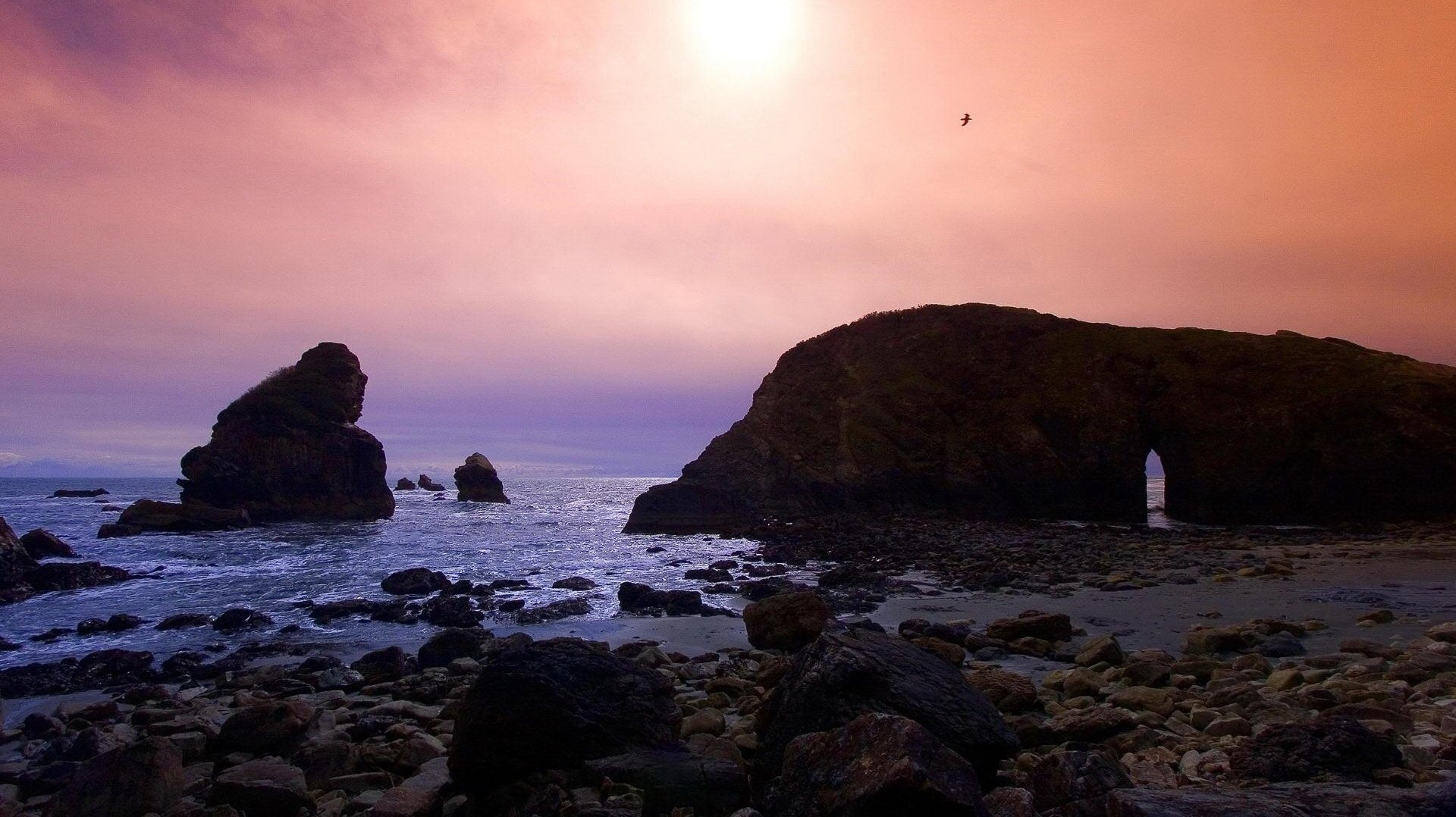 tone sculpture natural architecture sea stones bird the sky landscape the sun shore