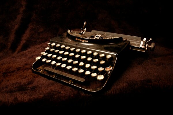 An old typewriter on a brown background