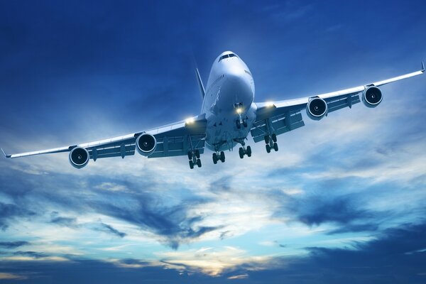 A passenger plane flying in a beautiful sky