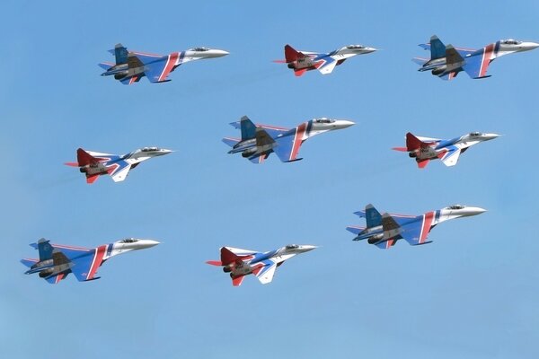 Nine Su 27 aircraft are flying in the same direction