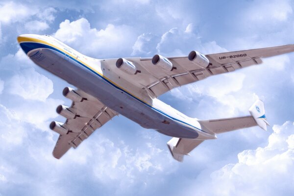 Imagen con un avión flotando en el cielo