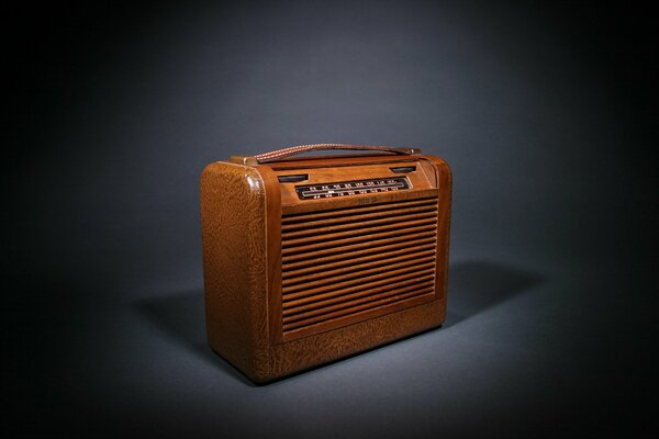 Vintage radio receiver on a black background