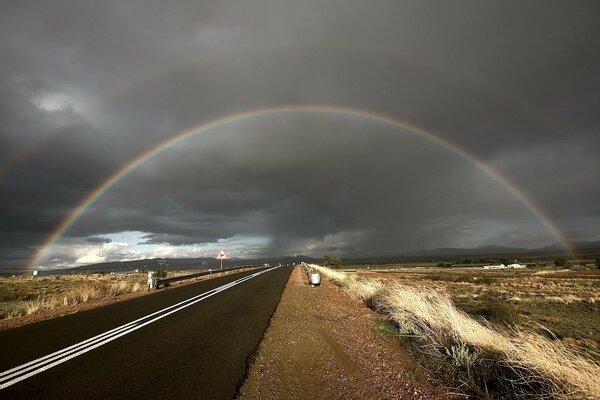 A huge rainbow in the overcast sky