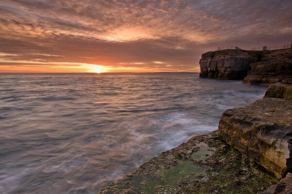 The horizon is near the rocks. Stone staircase