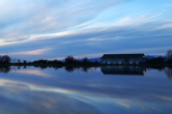 A mirror image of the sky in a pond