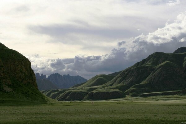 Green valley between two mountains