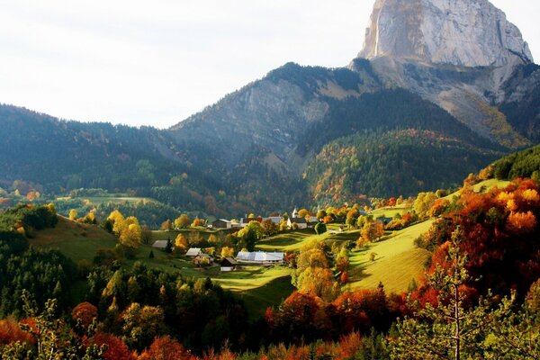 Hills, rocks, trees in a small village in sunny day