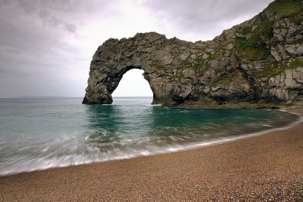 The cliffs of a secluded beach . The Power of nature