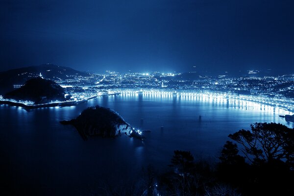 The long embankment glows in the night