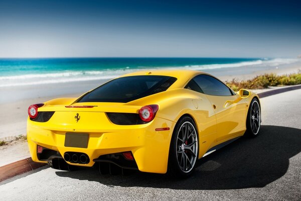 Bright yellow ferrari near the sea