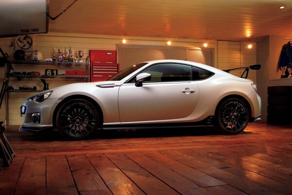 Beautiful white subaru car in the garage