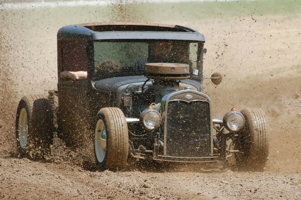 Race on old cars across the fields