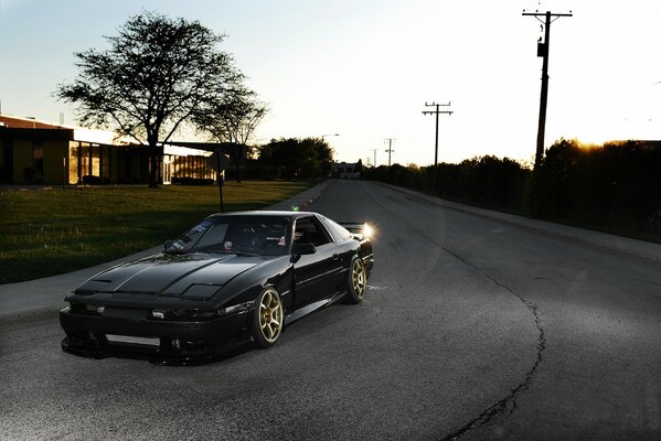 A tuned toy car parked on the road