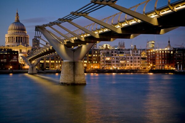A long city bridge over quiet water