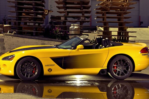 The accompanying yellow coupe convertible dodge viper