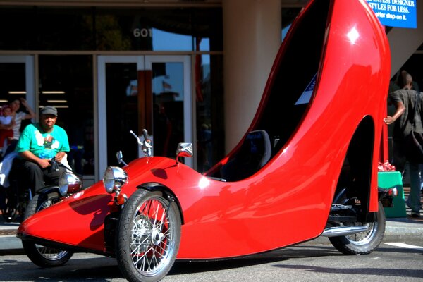 Funny car in the shape of a red shoe