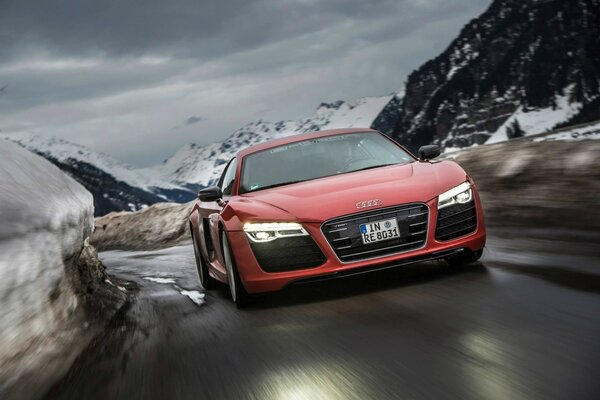 Red Audi at speed in the mountains