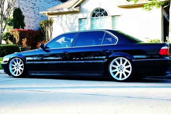 Black car on the background of a house