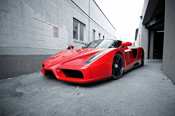 Red Ferrari on the streets of the city