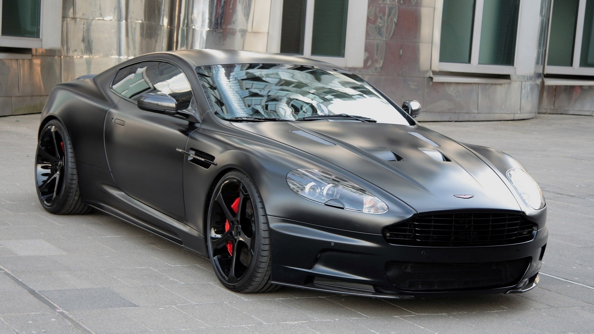 drives aston martin db9 black