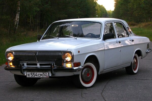 Retro Volga on the background of the road