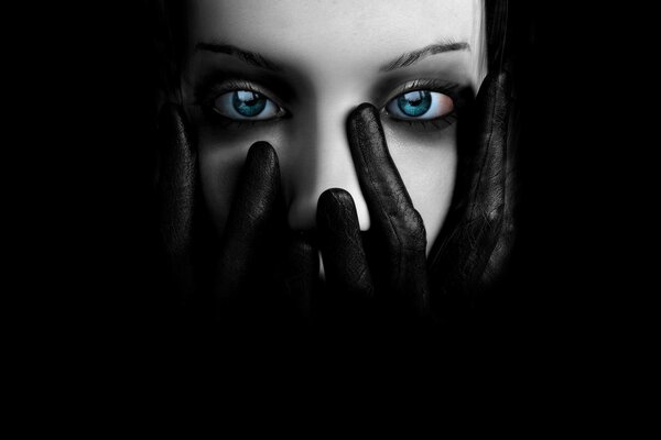 Blue-eyed girl in gloves