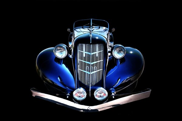 Blue retro car from the dark