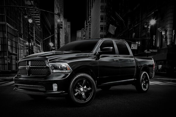 A black truck on a black street