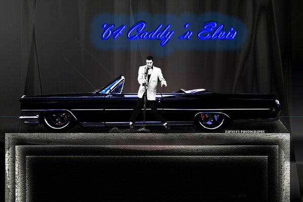 Elvis Presley next to a black retro car