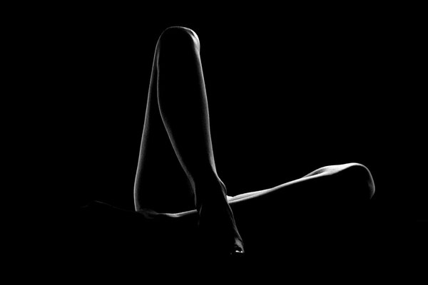 Lovely long legs on a black background