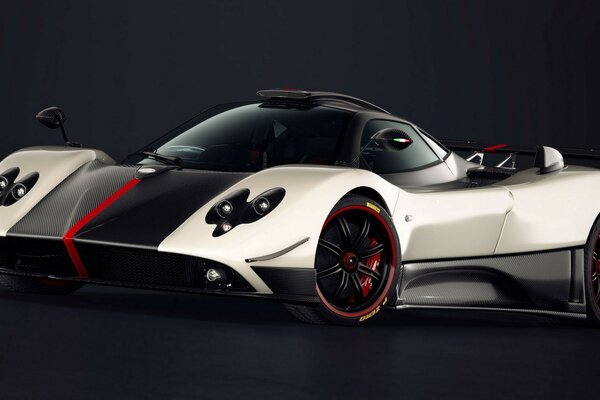 Supercar in white and black coloring with red stripes on a black background