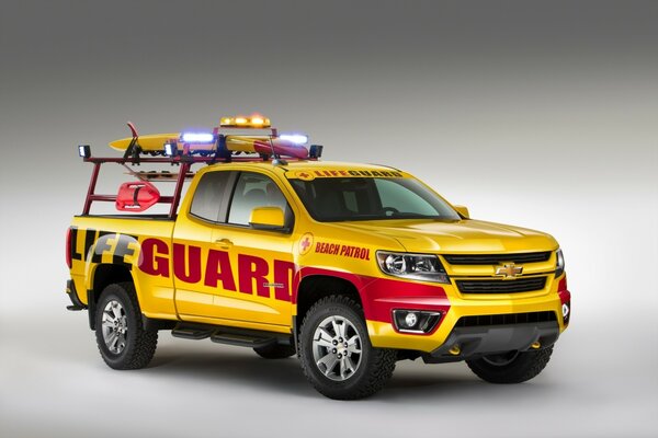 A yellow truck stands on a white background