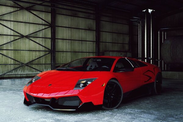 Lamborghini rosso in piedi nell hangar