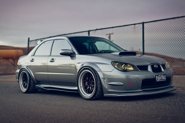 Grey Subaru Impreza from the side position