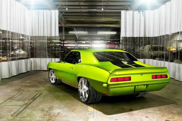 Light green graphic Chevrolet in the garage