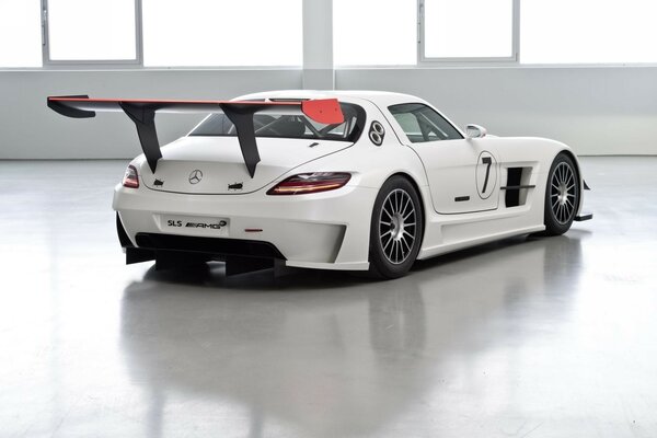 White supercar in a bright room