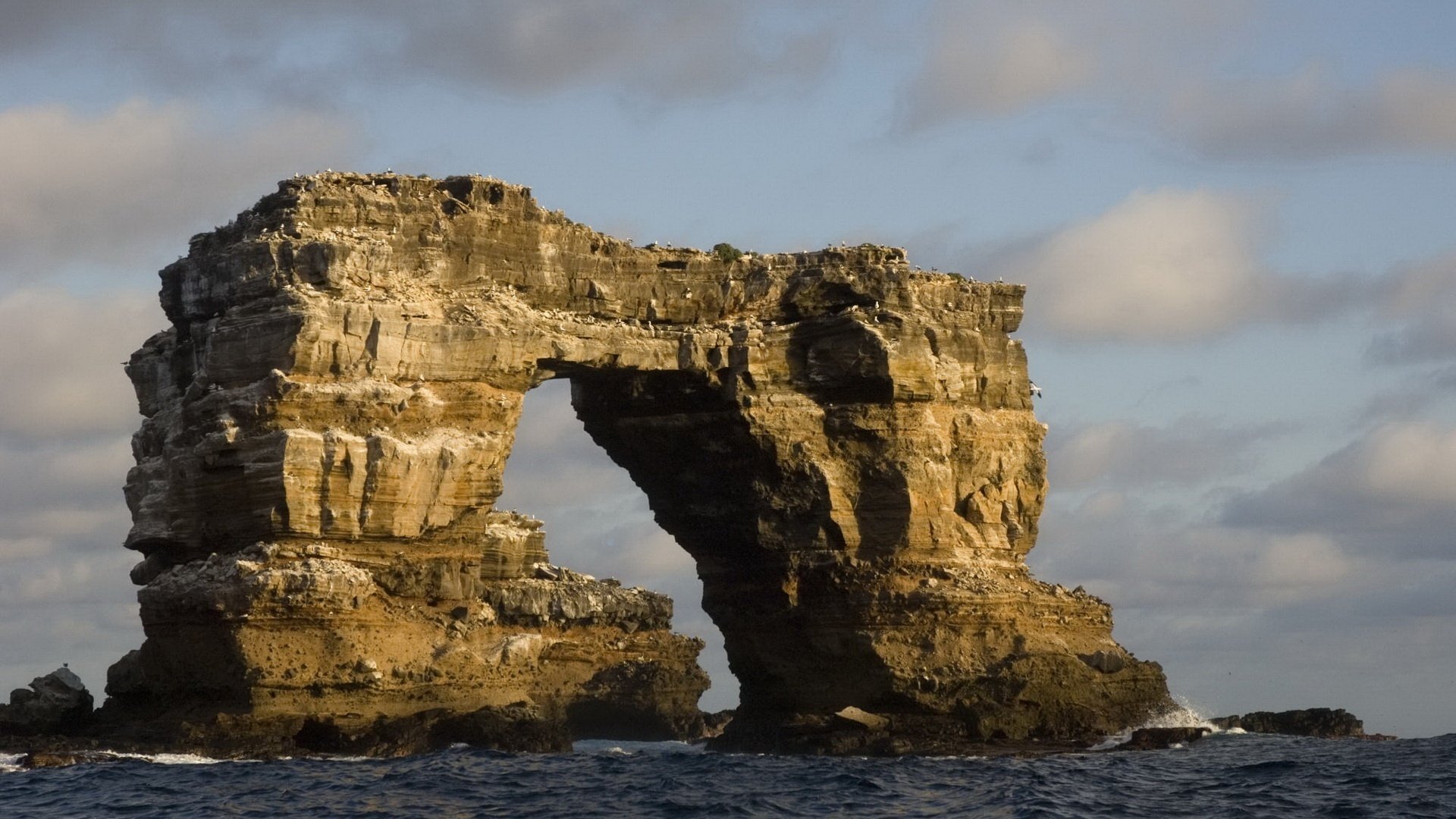 astillas arco de piedra mar golden gate rocas nubes olas