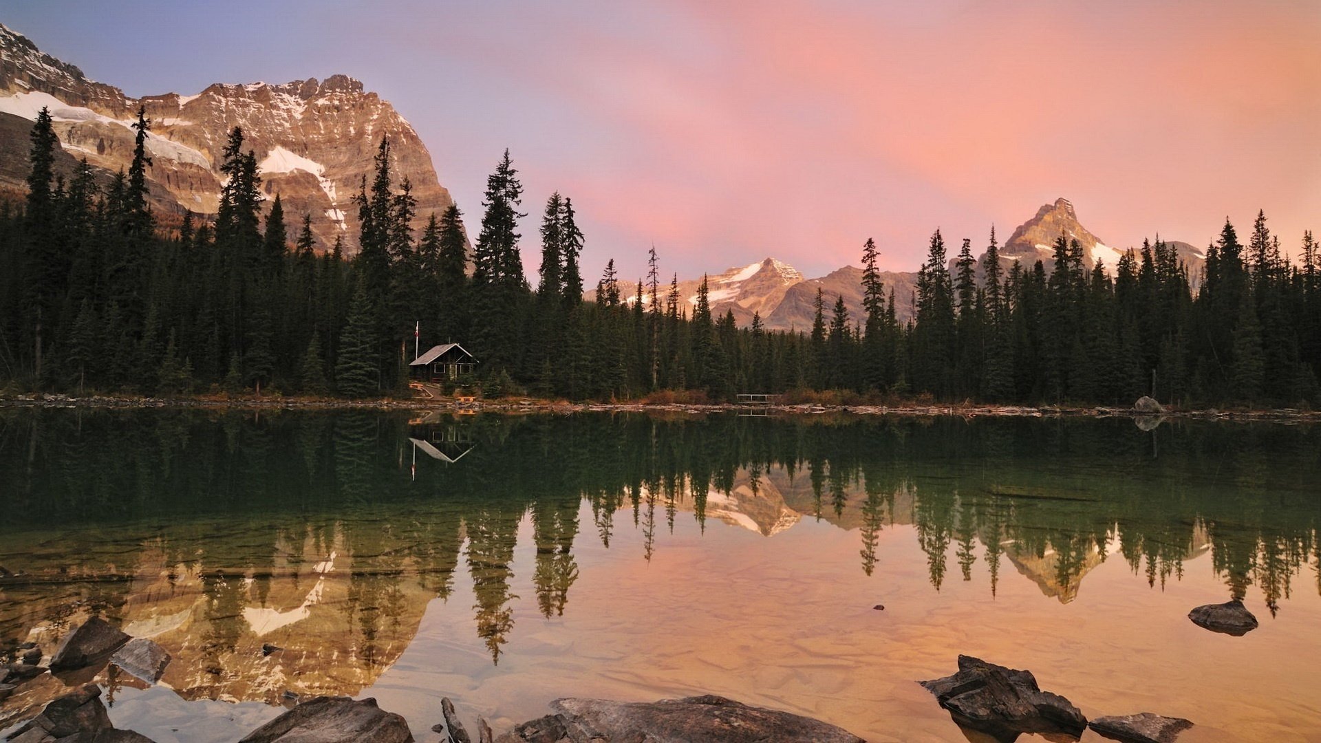 rock bottom flat shape christmas trees mountains forest water lake reflection clean water pink sky rocks ate landscape nature beauty