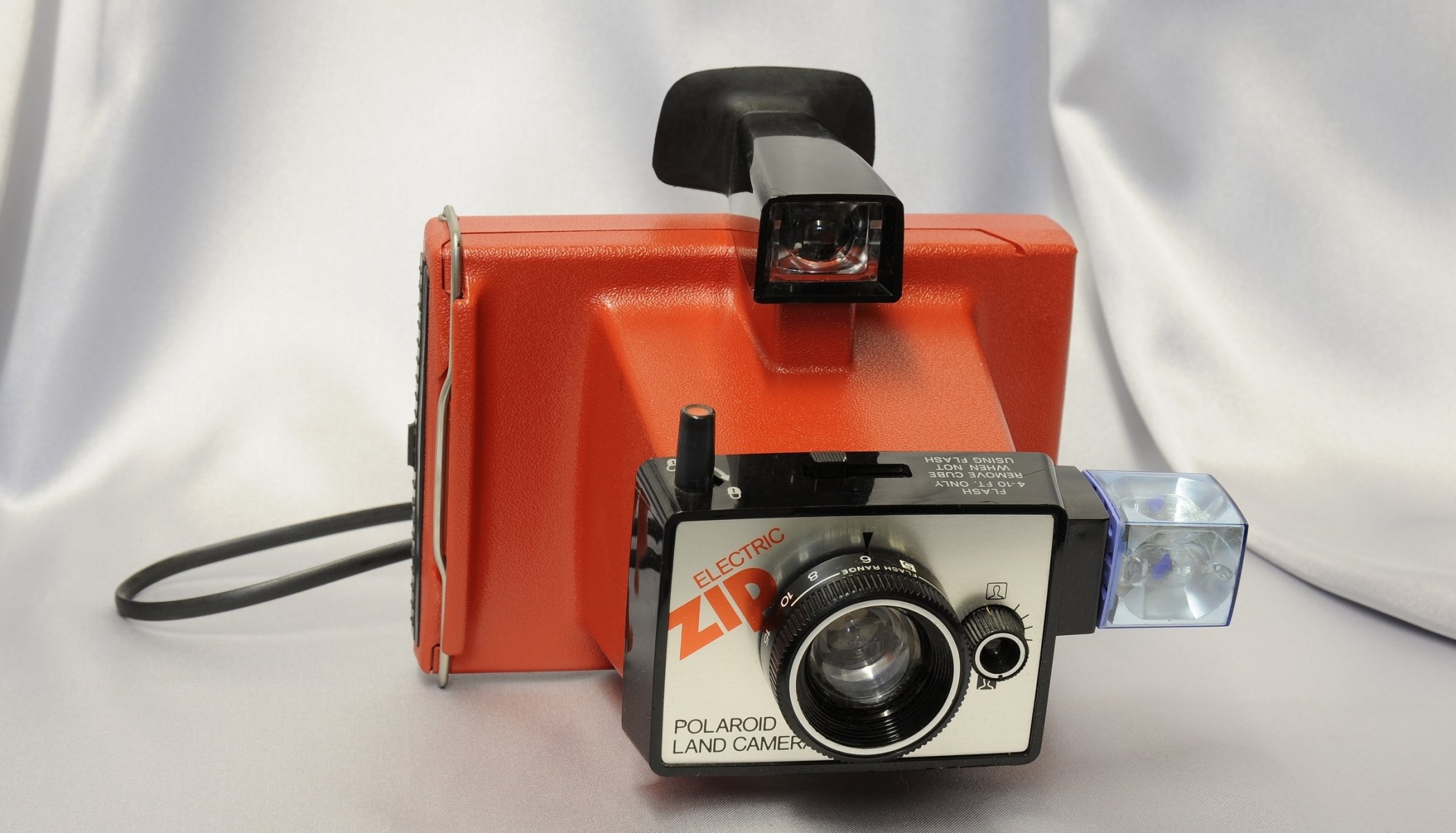 polaroid land kamera elektronische land kamera kunststoffgehäuse objektiv sucher blitz hintergrund