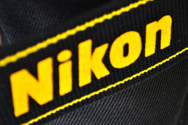 Nikon lettering in yellow on a black background