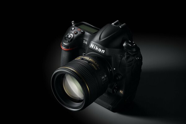 Nikon camera with a lens on a black background