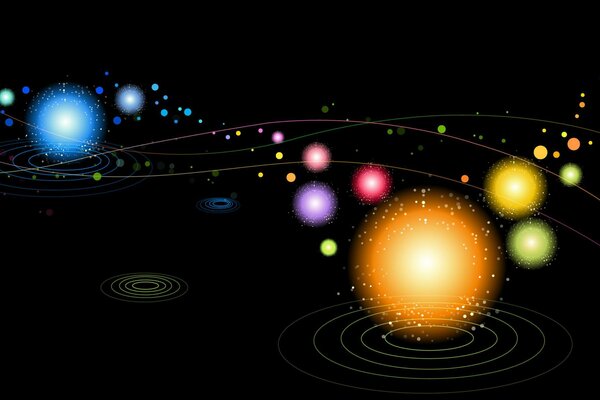 Spheres of different sizes and colors on a black background